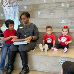 Angela Evans reading to children at Read Across America event
